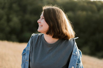 Beautiful portrait of a  stylish woman on a sunny day in autumn