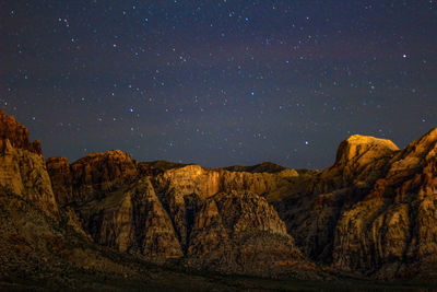 Rocky mountains against starry sky