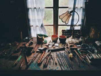 Clothes drying on table against window