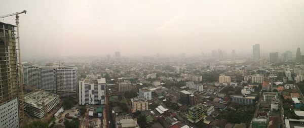 High angle view of buildings in city against sky