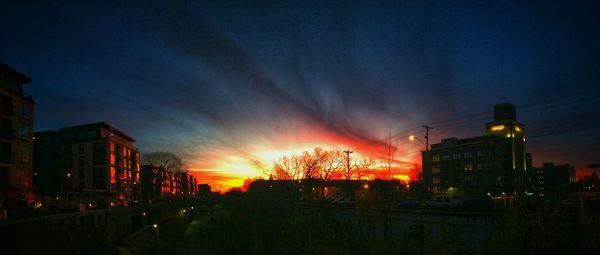 Buildings in city at sunset