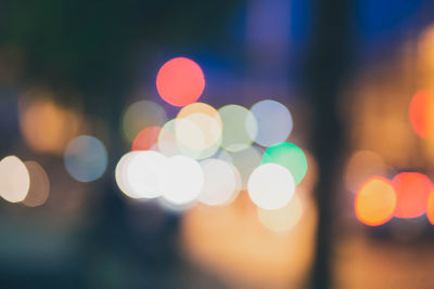 Defocused image of illuminated lights at night