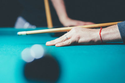 Person playing with ball on table