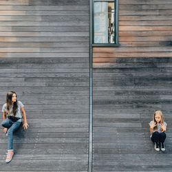 Woman standing by railing