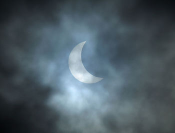 Low angle view of moon against sky at night