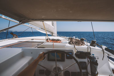 Boat sailing on sea against sky