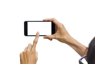 Low angle view of hand using smart phone against white background