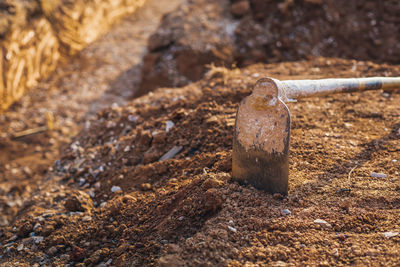 Close-up of rusty chain on field