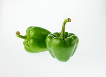 Close-up of green bell pepper against white background