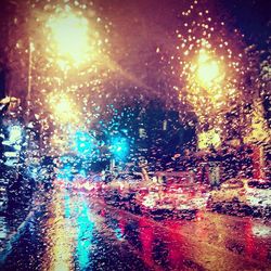 Close-up of illuminated lamp at night