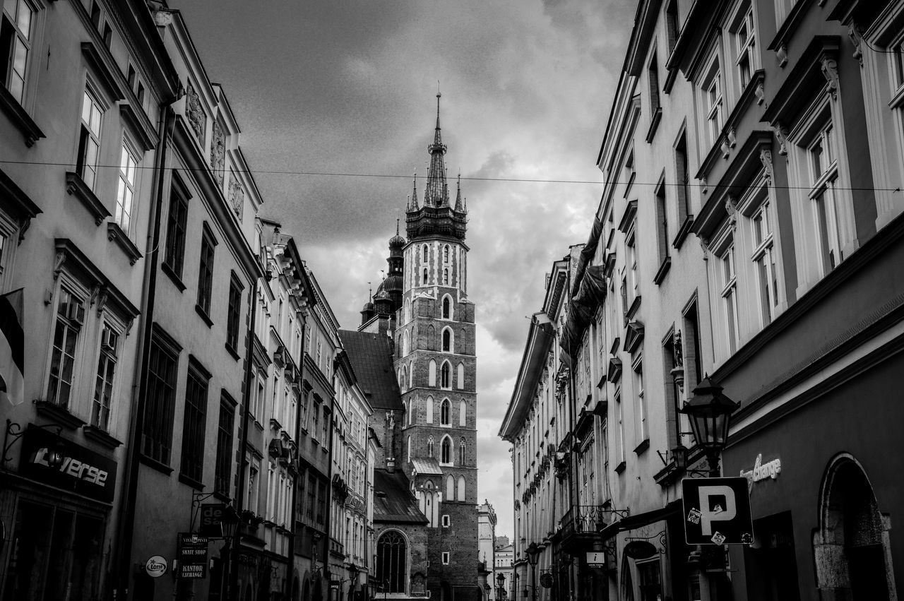 architecture, building exterior, built structure, low angle view, religion, church, city, tower, place of worship, clock tower, sky, spirituality, tall - high, cathedral, travel destinations, building, window, famous place