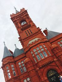 Low angle view of clock tower against sky