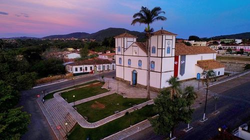 High angle view of swimming pool by building against sky