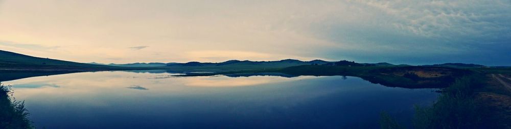 Reflection of clouds in calm lake