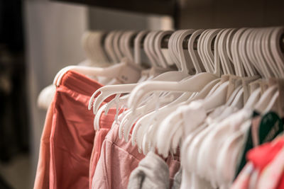 Close-up of clothes hanging on rack