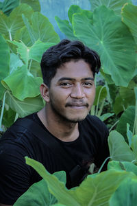 Portrait of young man smiling outdoors