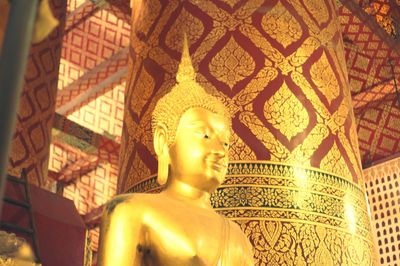 Low angle view of buddha statue in temple