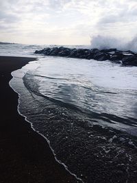 Scenic view of beach against sky