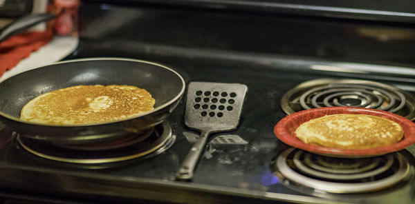 Close-up of food in cooking pan on stove