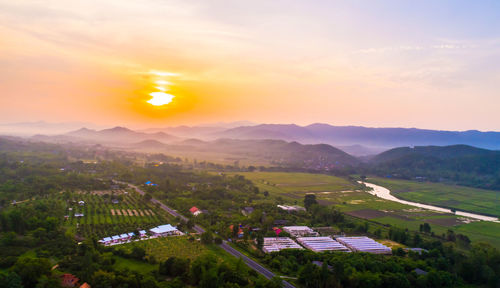 High angle view of townscape against sky during sunset