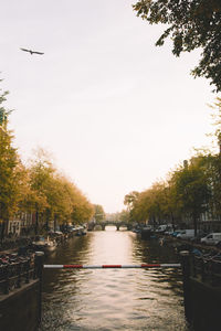 Boats moored in river