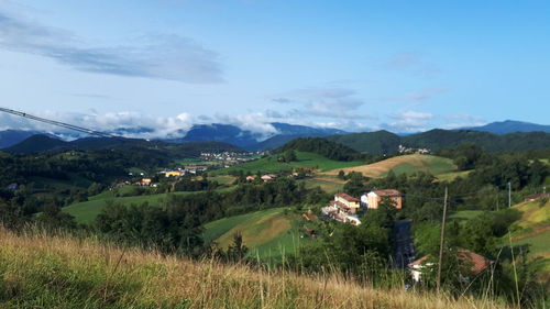 Scenic view of landscape and mountains against sky