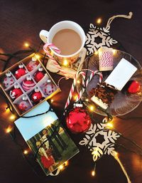 High angle view of illuminated lamp on table