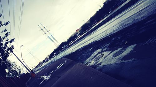 Cars on road against sky