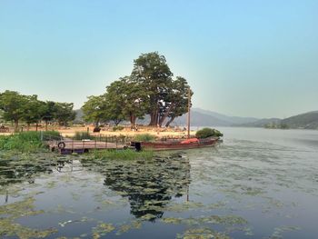 Scenic view of calm lake against clear sky