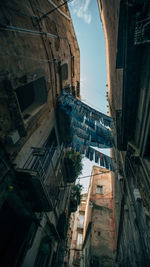 Low angle view of buildings in city against sky