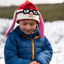 Portrait of cute boy in snow