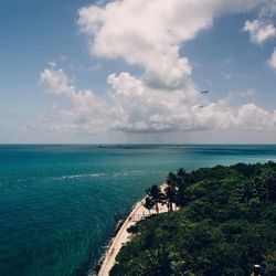 Scenic view of sea against cloudy sky