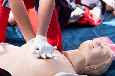 Midsection of woman lying on bed