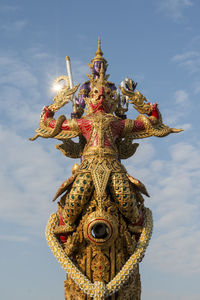 Low angle view of statue against sky