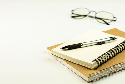 High angle view of pen on table against white background