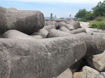 Stack of rocks on beach against sky