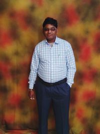 Portrait of young man standing outdoors during autumn