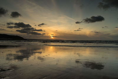 Scenic view of sea against sky during sunset