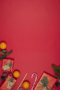 High angle view of christmas decorations against colored background