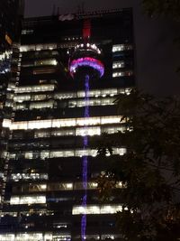 Low angle view of illuminated buildings at night