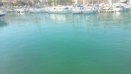 Boats moored in river