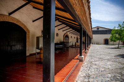 Empty corridor of building with city in background