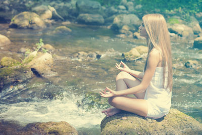 Portrait of woman relaxing on beach
