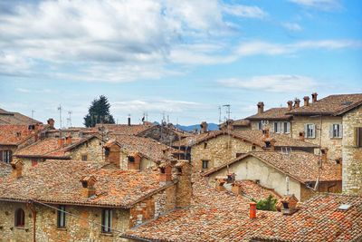 Houses in town against sky