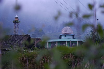 A simple dome and minaret in a highland area with cool air on the slopes of merbabu, central java.