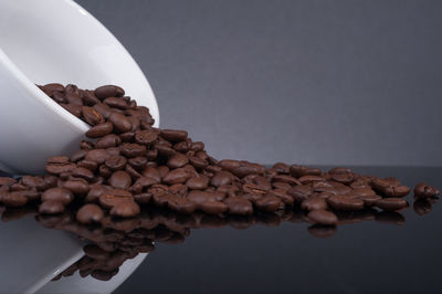 Close-up of coffee beans on table