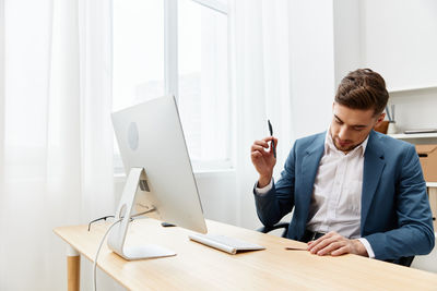 Portrait of businessman working at office