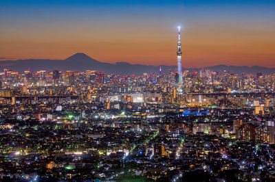 Illuminated buildings in city at night