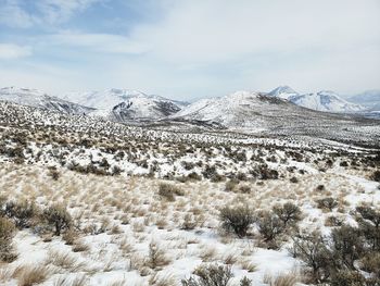 Scenic view of snowcapped mountains against sky