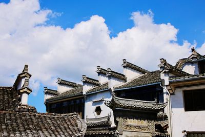 Low angle view of roof against sky